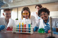 Young chemistry students having a good time in a sterile laboratory environment