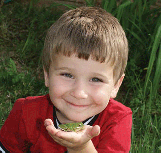 A young boy and his frog