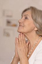 A lady is praying.