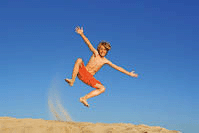 happy child jumping on beach